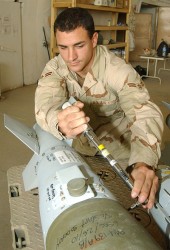 An airman assembles a GBU-38 500-pound Joint Direct Attack Munition, the same weapon that destroyed Zarqawi's safe house.