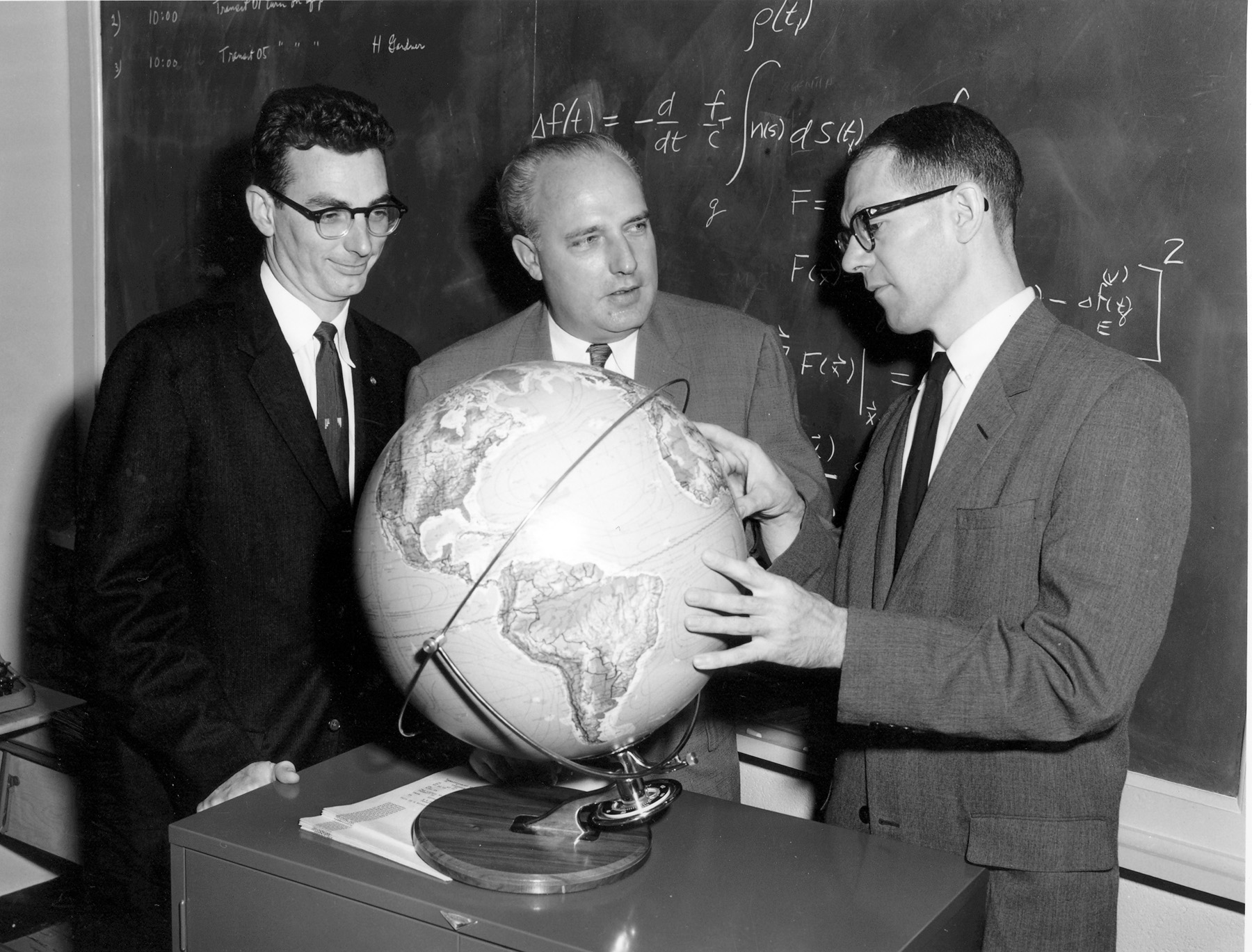 Mathematician Bill Guier (l) and physicist George Weiffenbach (r), told APL Research Center director Frank T. McClure (c), about their success using Doppler tracking for satellites. “McClure’s brain started going into fast forward,” remembered John Dassoulas. “Knowing the navigational challenges the U.S. Navy faced, McClure said, ‘Well, if you can find out where the satellite is, you ought to be able to turn that problem upside down and find out where you are.’" (Credit: Bradford W. Parkinson and Stephen T. Powers)