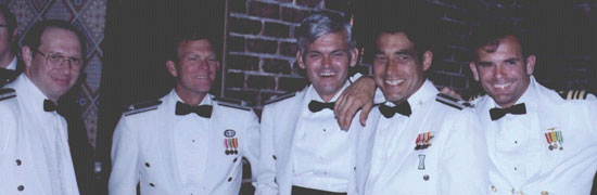 Some of the JPO Heroes at a "dining-in," a recognition dinner. From left, Major Mel Birnbaum (made many important contributions. He was famous for marathon code reviews that could last 18 hours straight. He hated to miss schedules!); Col. Don Henderson (later Maj. Gen.) second Air Force deputy; Major Ralph Tourino (later Maj. Gen.), Program Control; Lt. Col. Ken Juvette. director of procurement; and LCdr. Joe Strada, a key leader in the extensive test program. (Credit: Bradford W. Parkinson and Stephen T. Powers)
