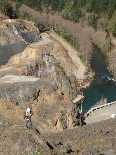 The panga team constructs a bedrock drill-brace geodetic monument at Howard Hanson Dam east of Auburn, Washington.