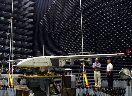 The Navy’s Communications and GPS Navigation Program Office (PMW/A 170) mounted a Small Antenna System on an Aerostar unmanned aircraft then placed it in a room lined with signal-absorbent material, where it was subjected to GPS jamming signals at Naval Air Station Patuxent River, Md. Part of an initiative to protect GPS technologies on small unmanned aerial vehicles, the Navy conducted the tests in July to demonstrate how miniaturized GPS protection devices can prevent interruption of the mission-critical global positioning data. (U.S. Navy photo)