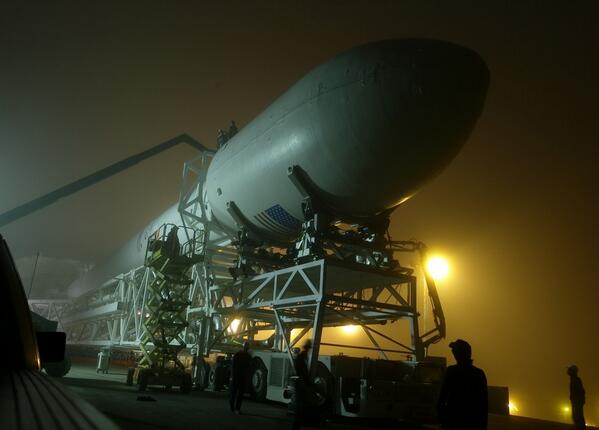 The Falcon 9 rocket, with CASSIOPE inside its fairing, on the way to the launch pad at Vandenberg Air Force Base. (Photo credit: SpaceX).