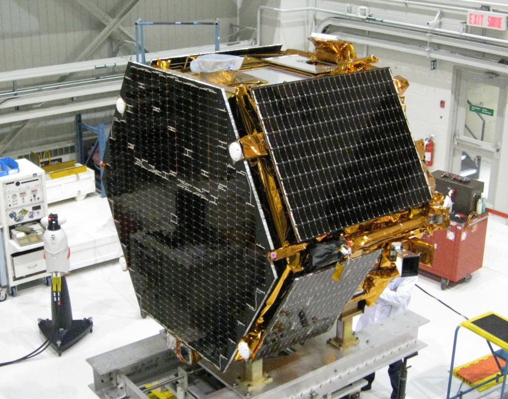 The research satellite CASSIOPE on a test platform at the Canadian Space Agency’s David Florida Laboratory. CASSIOPE hosts the GPS Attitude, Positioning, and Profiling instrument designed by GGE researchers. It is currently scheduled for launch in 2010. The four white antennas on the left-facing side of the spacecraft will be used to determine the position, velocity, and attitude of the spacecraft while the antenna on the upper side will be used to profile the ionosphere’s electron density. Photograph courtesy of MacDonald, Dettwiler and Associates Ltd.