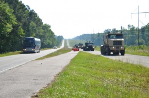 Military and industry VIPs drove alongside the convoy in a bus to watch the unmanned convoy demonstration.