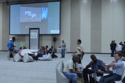 Conference exhibitors at the Esri UC take a seat.