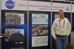 A member of NASA Langley's GIS Team mans the booth on the show floor.