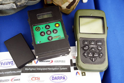 The Warfighter Integrated Navigation System, center, uses inertial systems to determine a Soldier's location in the absence of a GPS signal. On the left, a smaller version of WINS. On the right, the Defense Advanced GPS Receiver, which soldiers use now for position, navigation, and timing. All three devices were on display at the DOD Lab Day, May 14, at the Pentagon. (Photo: U.S. Army/C. Todd Lopez)