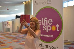 Hila Liberty of selfie-friendly case company #SelfMee tries out a Selfie Spot. (Photo: Bethany Chambers)