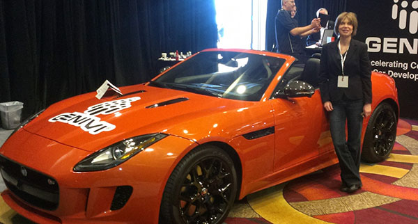 Janice Partyka at the LA Auto Show with a car representing the GENIVI Alliance, a non-profit automotive industry alliance committed to driving the broad adoption of an in-vehicle Infotainment open-source development platform. (Photo: courtesy of Janice Partyka)