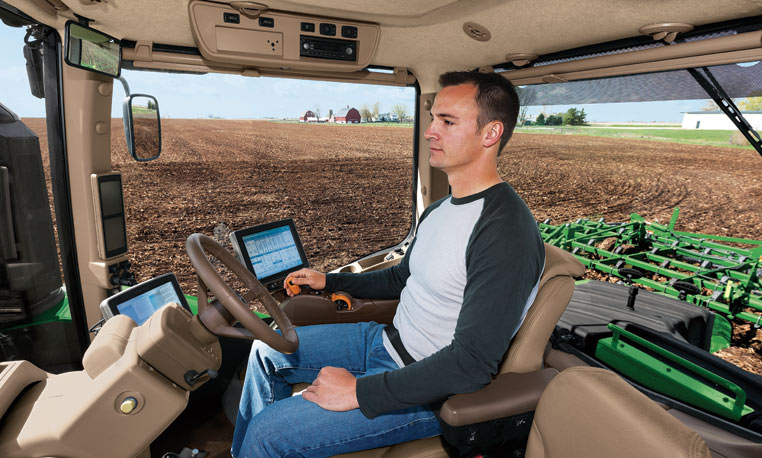 Hands-free driving: Ag companies take the wheel. (Photo: John Deere).