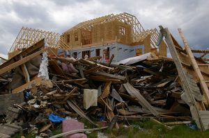 June 28, 2008: A house in Parkersburg, Iowa, is being rebuilt while debris from a deadly EF5 tornado still covers the ground. (Photo: FEMA/Richard O’Reilly)