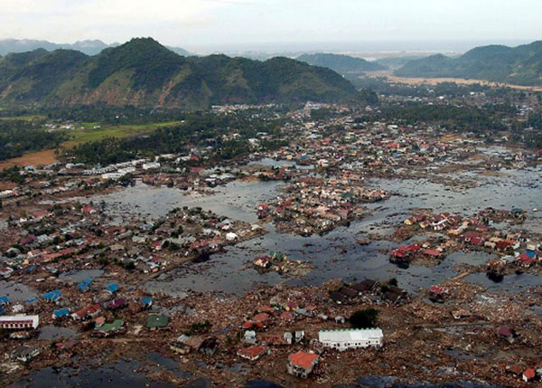 Indian Ocean (Jan. 2, 2005): A village near the coast of Sumatra lays in ruin after the Tsunami that struck South East Asia. (Photo: U.S. Navy/Photographer's Mate 2nd Class Philip A. McDaniel)