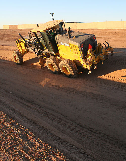 The base of the channel was just wide enough (12 feet) to fit the John Deere machine for grading the 2:1 slope. With GNSS, the operator did not have to reference grade stakes or stop for grade checks. (Photo: Topcon)