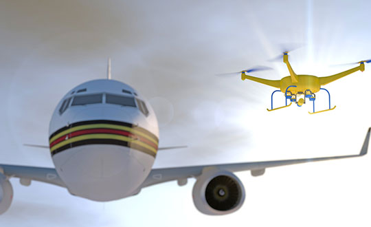 Artist concept of a drone approaching a commercial airliner. Image: PixOne/Shutterstock.com