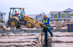 A surveyor checks an urban construction project. (Photo: Topcon)