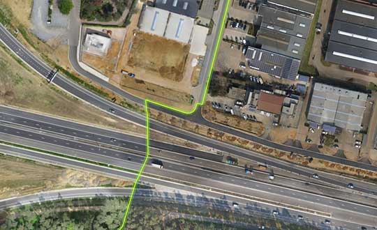 This image features a mosaic of two orthophotos with the applied cutline displayed. Photo: Virtual Surveyor