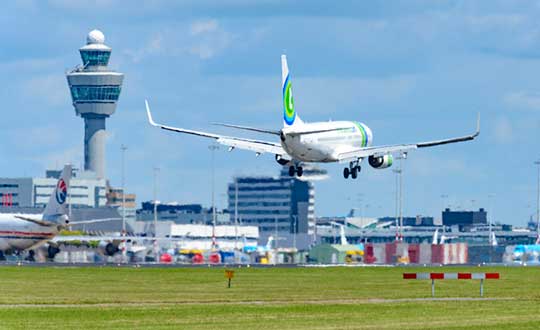 Aircraft throughout Europe are guided by EUROCONTROL, which will have access to ADS-B data through Aireon. Here, a plane lands at Schiphol Airport in The Netherlands. (Photo: Sjo/iStock Unreleased/Getty Images Plus)