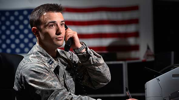 Capt. Jeff Wagner discusses a routine health check on a GPS satellite. 2 SOPS performs the command and control mission for the constellation. (Photo: U.S. Space Force / Kathryn Calvert)