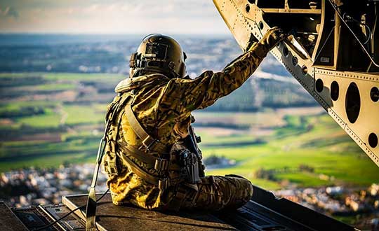 Staff Sgt. Daniel Pennington, a flight engineer assigned to B Co "Big Windy," 1-214th General Support Aviation Battalion, takes in his 'office' view from the ramp of his CH-47 Chinook while flying over the island of Cyprus on Jan. 14, 2020. (Photo: U.S. Army/Maj. Robert Fellingham)