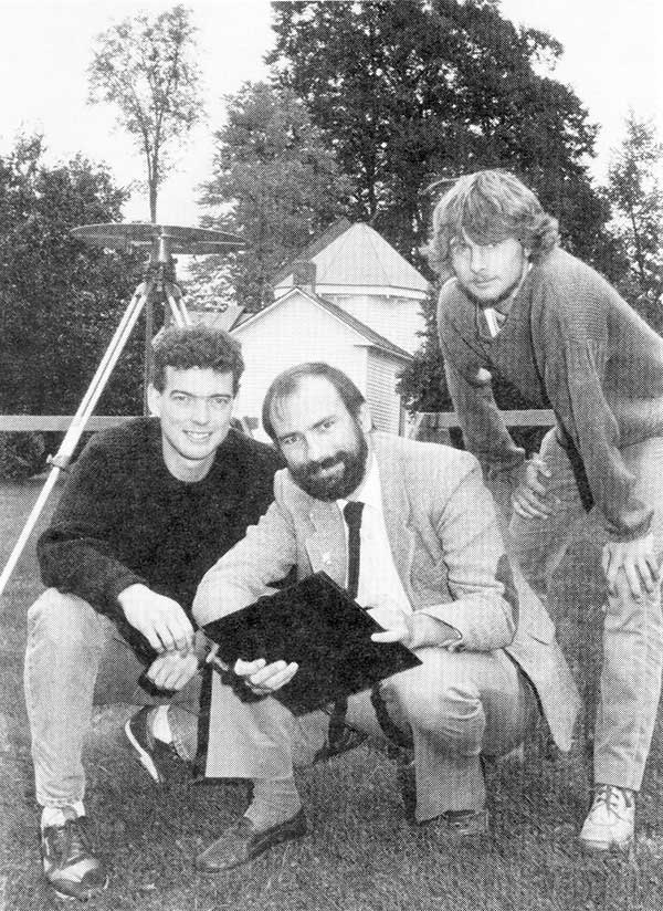 1990: UNB Professor Richard Langley and two graduate students use a GPS antenna (recognize it?) on a tripod to re-measure a historical baseline. (Photo: UNB Perspectives)