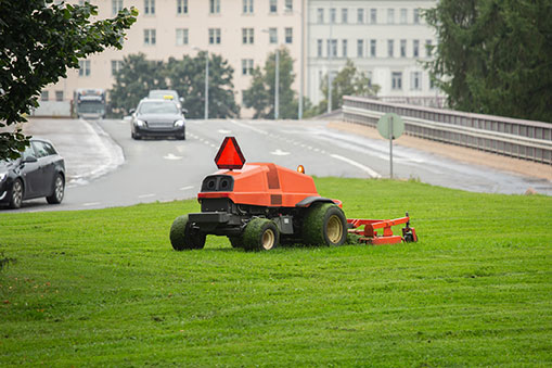 An autonomous lawn mower trims the grass in a park in Finland. (Photo: Scharfsinn86/iStock/Getty Images Plus/Getty Images)