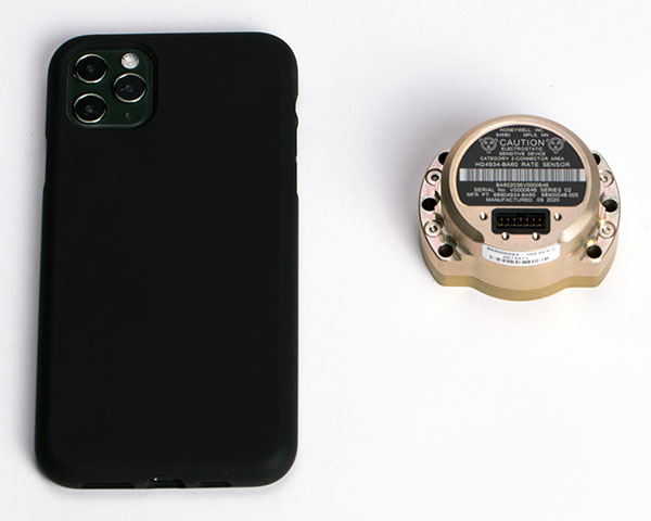 The HG4934 Space Rate Sensor is compared in size to a typical smartphone. (Photo: Honeywell)