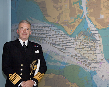 Admiral Sir Alan West, then First Sea Lord, is pictured with the official chart of anchorages for the International Fleet Review. (Photo: DP Kilfeather's book Trafalgar 200 Through the Lens Queen Elizabeth II 80th Birthday Edition, CC BY-SA 2.5)