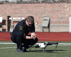 A policeman works with a drone. (Photo: FAA)