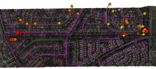 A distribution network (purple) and vegetation risks (red/yellow pins). (Image: NV5 Geospatial)