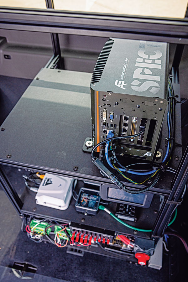 Hexagon | AutonomouStuff’s hardware rack inside the Ford Transit shuttle. (Photo: Hexagon | AutonomouStuff)