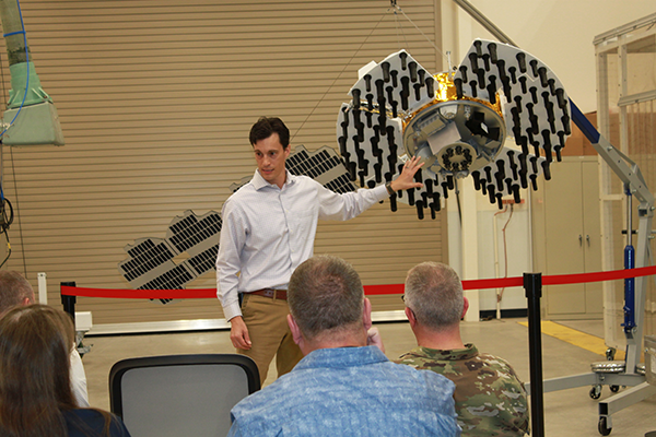 Arlen Biersgreen, NTS-3 program manager, uses a 1:3 scale model to describe the spacecraft and details of the one-year experimental mission during Media Day on June 23, 2022, at Kirtland Air Force Base. (Photo: U.S. Air Force/Andrea Rael)