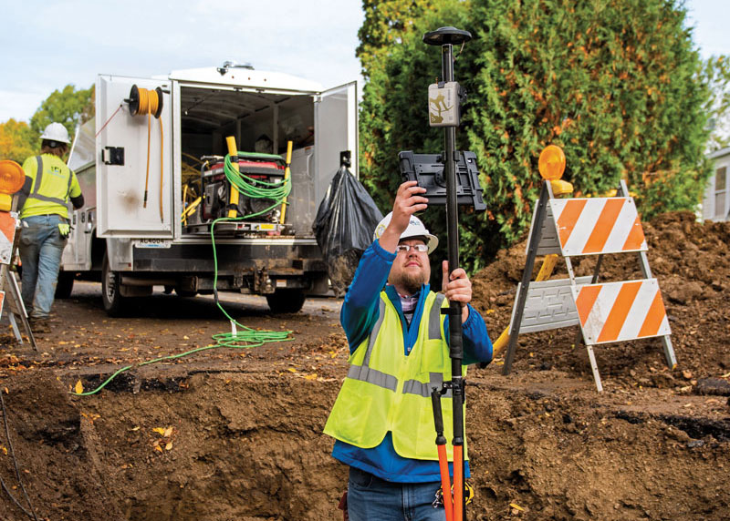 An Ellingson Companies surveyor works on an underground utility line. (Image: Ellingson Companies)