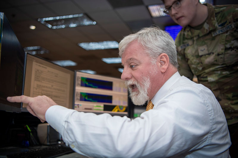 On the operations floor of the GPS Master Control Station at Schriever Space Force Base in Colorado, Luccio looks at feeds from a worldwide network of monitor stations and ground antennas. (Image: U.S. Space Force photo by Dennis Rogers)