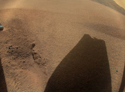 NASA’s Ingenuity took this picture on Jan. 18, 2024. The sand-dune, rock-less area where Ingenuity last showing the shadow of its damaged rotor blade. (Image: NASA)