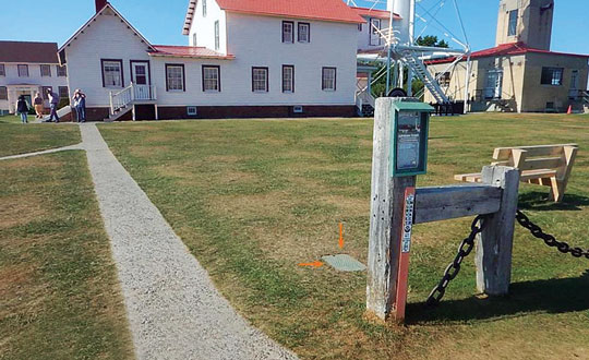 Figure 1: Utility access box installed over CORS reference mark Whitefish Pt A (NGS PID AA8050) at USCG lighthouse. (Photo: Jeff Olsen)