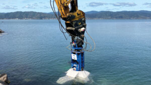 operators of excavators with grapple attachments needed to move eight different block shapes into place with an 80 mm tolerance. Photo: Trimble