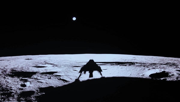 An image captured by Blue Ghost shows its shadow on the moon’s surface, with Earth on the horizon. (Photo: Firefly Aerospace)