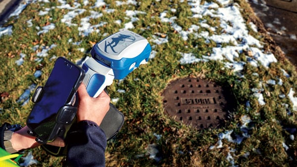 The Eos Positioning Systems Skadi rover fits on a pole, or this handle with automated height-above-ground and offset features measurement sensors. (Photo: Eric Gakstatter)