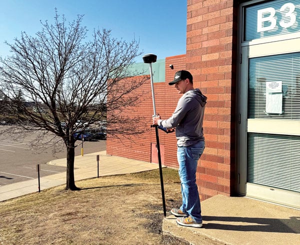 A GNSS+IMU+Camera integration: the Tersus Trek, here shown being used on a survey for a school expansion project. (Photo: Dustin Harr, Desert Creative group.)