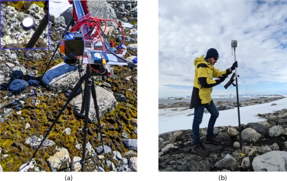 ASPA 135 ground setup for HSI and GNSS RTK data collection. (a) Precise positioning of a Konova slider attached to two tripods on rocks, to minimize disturbance of moss and lichen. (b) GNSS RTK point collection with a Trimble R10 antenna on a fixed marker with known coordinates. (Credit: QUT)