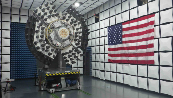 The Navigation Technology Satellite-3 (NTS-3) spacecraft is shown in an anechoic test chamber prior to electromagnetic interference and electromagnetic compatibility testing in Palm Bay, Florida. This experimental satellite is being designed, built and tested by L3Harris Technologies, and will be used by the Air Force Research Laboratory and partner organizations as part of an integrated system to conduct a one-year demonstration of advanced technologies and concepts in satellite navigation. (Credit: AFRL)