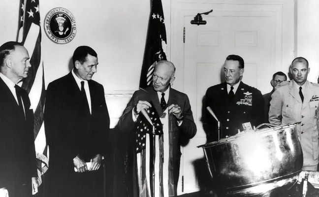 Photo: PRESIDENT EISENHOWER awards Capt. Mitchell, USAF, C-119 pilot, the Distinguished Flying Cross for the first ever capture of
a film cartridge dropped from space, in a photo circa 1960. cia.gov/resources/csi/static/corona.pdf 