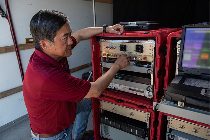 A Raytheon technician operates the rapidly installed JPALS equipment during a demonstration at the Naval Air Station. (Photo: Raytheon)